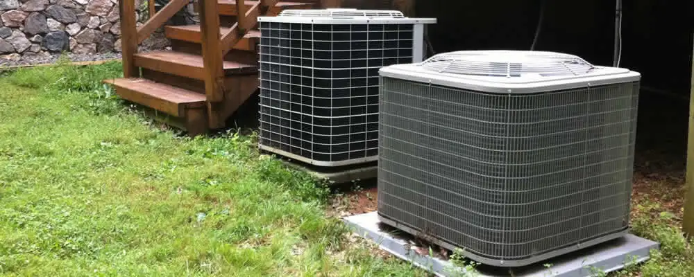Heat pump installation and service units outside a home in Minneapolis, MN