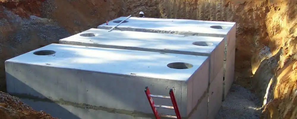 Septic tank installation site with a newly placed concrete tank in Minneapolis, MN